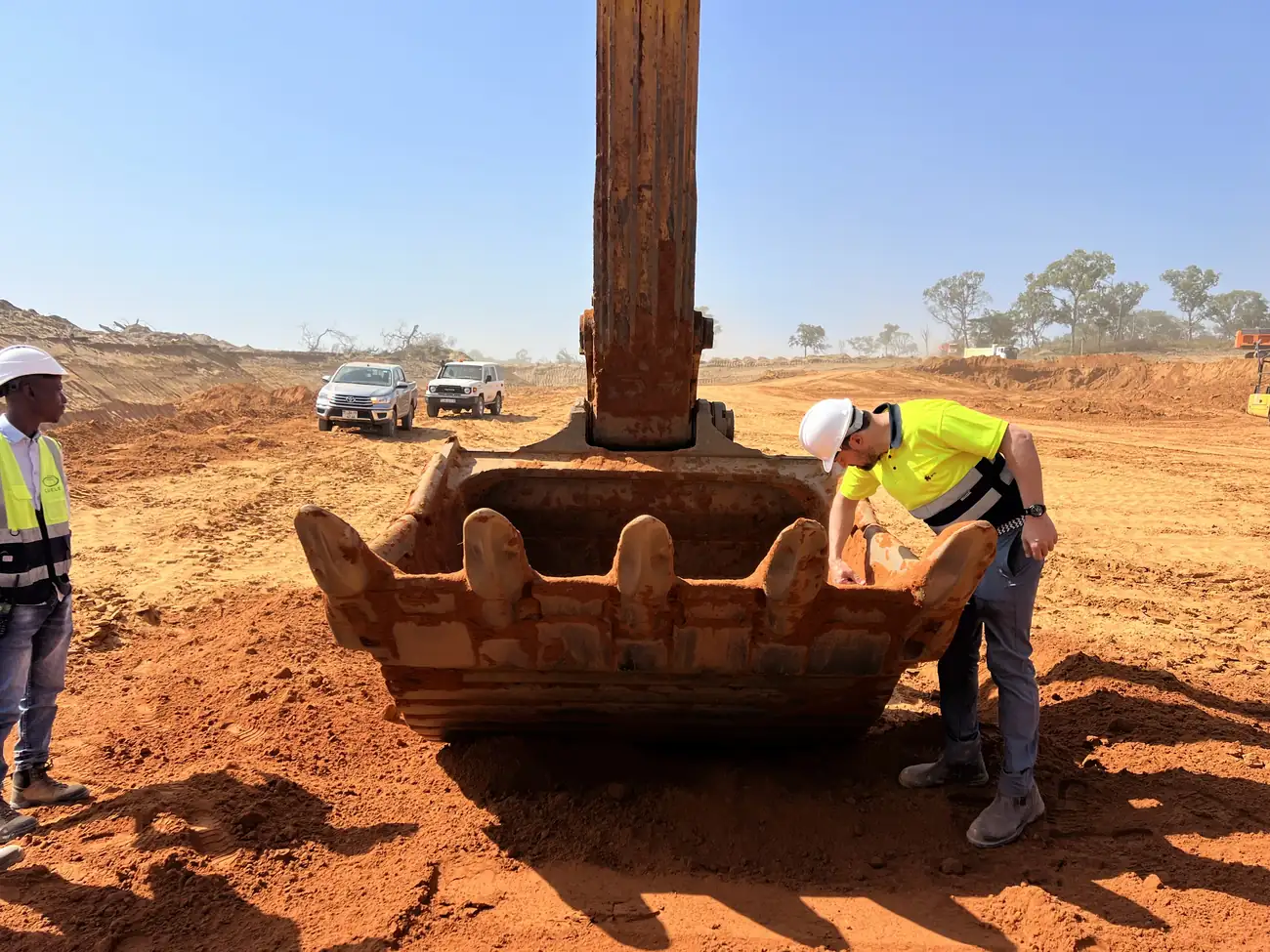 TMS engineer inspecting a bucket lip on site